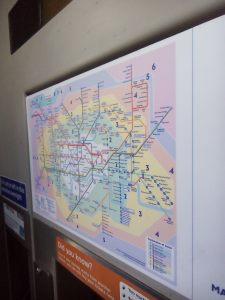 A public information display explaining the London public transport zone system 